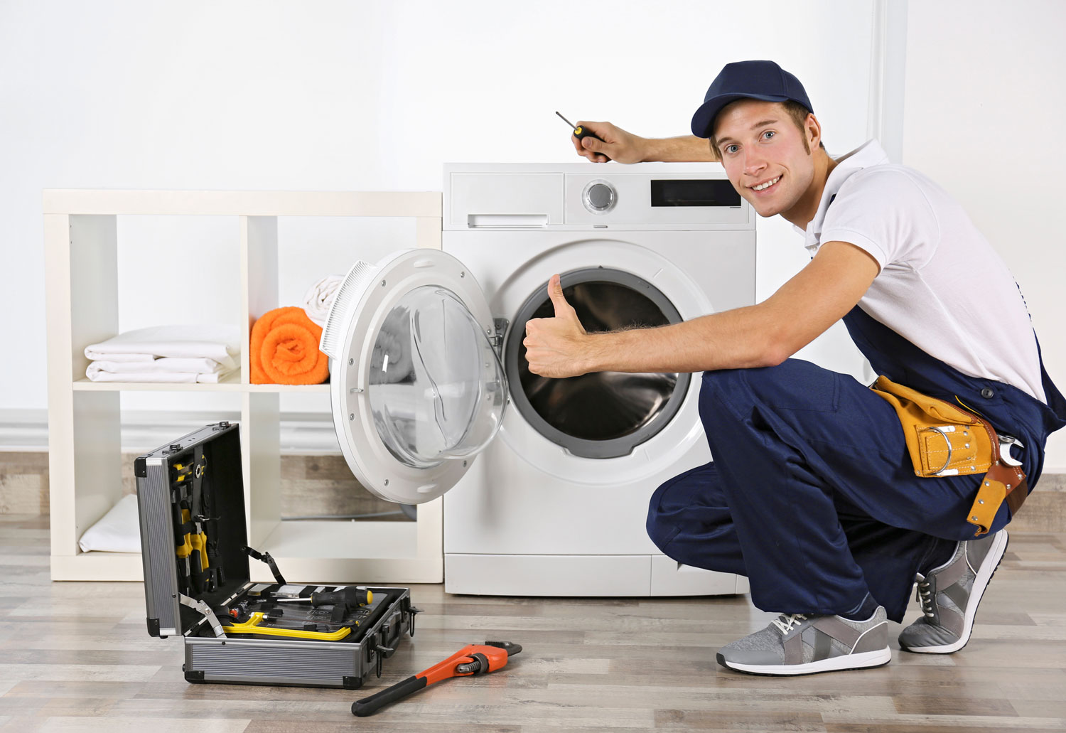 plumber-repairing-washing-machine